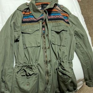 Army green jacket with zipper and buttons, pockets, tie string.
